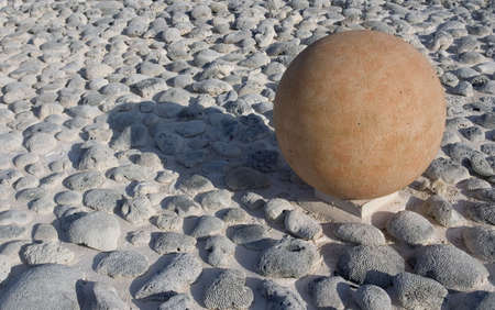 Composition of field with corals and ball with shadow.