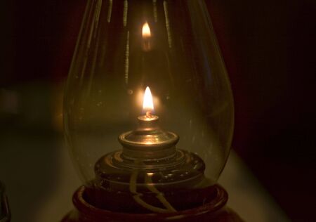 Old fashion oil lamp in the dark room.の写真素材