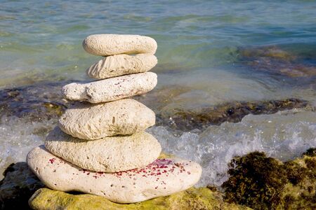 Zen like stack of stones on the sea shore.の写真素材