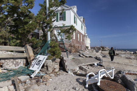 NEW YORK - NOVEMBER 12, 2012:Pile of garbage, debris near flooded and damaged house after Hurricane Sandy  on Manhattan Beach on November 12, 2012, Brooklyn, NYのeditorial素材