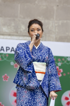 NEW YORK, NY - MAY 12: Host SANDRA ENDO makes an announcement during Japan Day at Central Park on May 12, 2013 in New York City.のeditorial素材