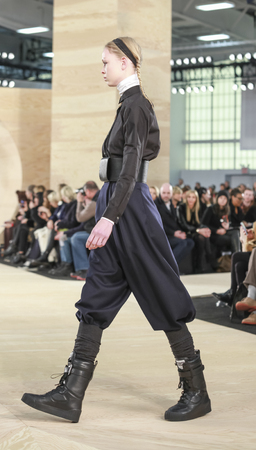 New York, NY, USA - February 11, 2014: A model walks the runway at Marc By Marc Jacobs Ready to Wear Fall/Winter 2014 collection during Mercedes-Benz Fashion Week New York at Pier 36, Manhattanのeditorial素材