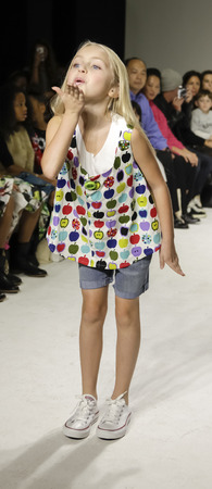 New York, NY, USA - October 19, 2014: A model walks the runway during the Aria Children's Clothing preview at petitePARADE / Kids Fashion Week at Bathhouse Studios, Manhattanのeditorial素材