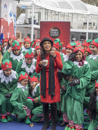 New York, NY, USA - December 2, 2014:  Actress Rosario Dawson kicks off Operation \'Give With Gusto\' in New York with NESCAFE Dolce Gusto and 100 Holiday Elves at Bryant Park, Manhattanのeditorial素材