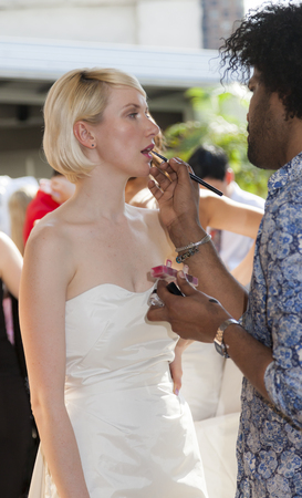 New York, NY, USA - April 18, 2015: A Model prepares backstage for The Spring Summer 2016 Malan Breton presentation for brides and grooms at The Empire Hotel Rooftop during New York Bridal week, Manhattanのeditorial素材