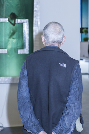 New York, NY, USA - May 16, 2015: Visitors view artworks at Art Miami New York, the international contemporary and modern art fair at Pier 94, Manhattan. Paintings, sculpture, installation from about 1200 artists from over 50 countries presented by 100 leのeditorial素材