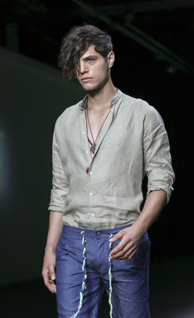 New York, NY, USA - July 15, 2015: A model walks the runway at Asaf Ganot Runway show during New York Fashion Week: Men's S/S 2016 at Art Beam, Manhattanのeditorial素材