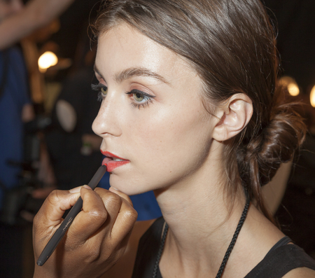New York, NY, USA - September 10, 2015: A model prepares backstage at the Desigual runway show during of Spring 2016 New York Fashion Week at The Arc, Skylight at Moynihan Station, Manhattan.  #CFDANYFW, #NYFW, #Desigual,のeditorial素材