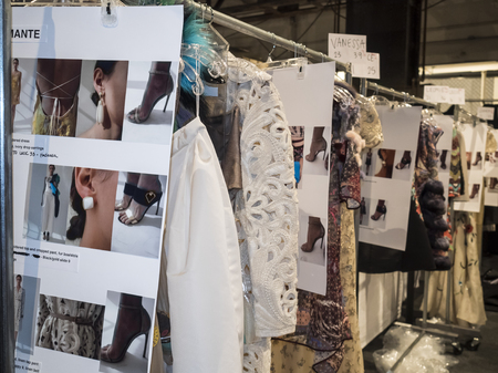 New York, NY, USA - September 15, 2015: Racks with dresses on backstage at Dennis Basso runway show during of Spring 2016 New York Fashion Week at The Arc, Skylight at Moynihan Station, Manhattan.  #CFDANYFW, #NYFW, #DENNISBASSOのeditorial素材