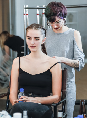 New York, NY, USA - October 8, 2015: A model prepares backstage for Marchesa Fall/Winter 2016 Bridal Presentation at Canoe Studio, Manhattanのeditorial素材
