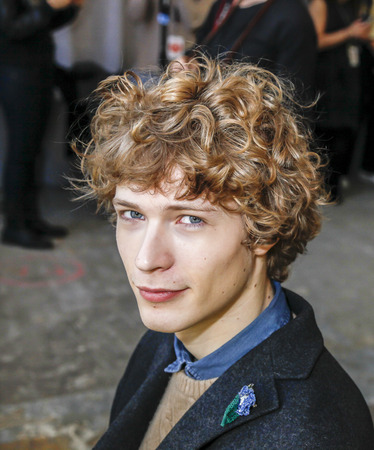 New York, NY, USA - February 2 2016:A model prepares backstage for Duckie Brown Fall 2016 runway show during NYFashion Week Men's at Skylight Clarkson North, Manhattanのeditorial素材