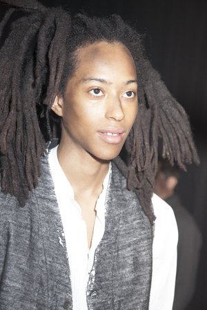 New York, NY, USA - February 3, 2016: A model prepares backstage for Greg Lauren Fall/Winter 2016 Men's presentation during NY Fashion Week Men's at Artbeam, Manhattanのeditorial素材