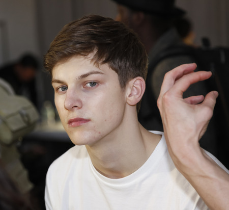 New York, NY, USA - February 2 2016:A model prepares backstage for Carlos Campos Fall 2016 runway show during NY Fashion Week Men's at Skylight Clarkson North, Manhattanのeditorial素材