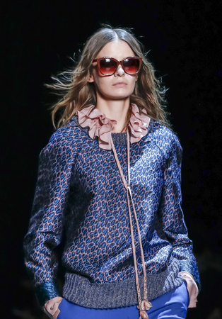 New York, NY, USA - February 13, 2016: A model walks the runway at the Monique Lhuillier runway show during of Fall/Winter 2016 New York Fashion Week at The Arc, Skylight at Moynihan Station, Manhattan.のeditorial素材