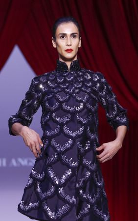 New York, NY, USA - February 14, 2016: A model walks the runway at the Farah Angsana runway show during of Fall/Winter 2016 New York STYLE Fashion Week at Gotham Hall, Manhattan.のeditorial素材