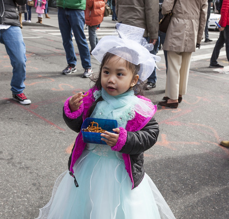 New York, NY, USA - March 27, 2016: Unidentified people in costumes attend 2016 New York Easter Parade and Bonnet Festival on 5th Avenue, Manhattan.のeditorial素材
