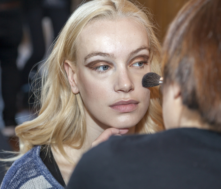New York, NY, USA - April 15, 2016: A model prepares backstage for RIVINI & Alyne Spring 2017 Bridal Collection at The Standart, High Line during New York International Bridal week, Manhattanのeditorial素材