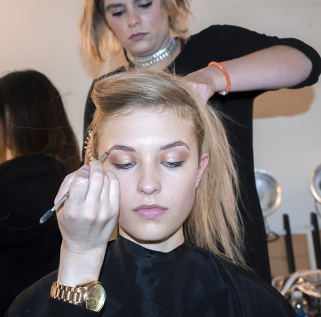 New York, NY, USA - September 13, 2016: A model prepares backstage for the Monique Lhuillier Spring/Summer 2017 runway show during New York Fashion Week SS 2017 at The IAC building, Manhattanのeditorial素材