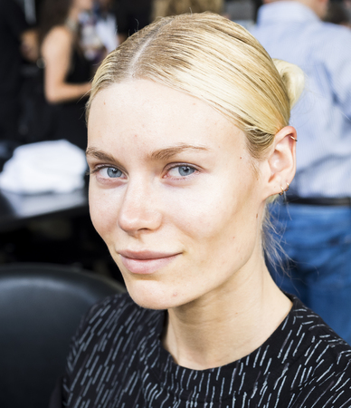 New York, NY, USA - September 11, 2016: A model prepares backstage for the Custo Barcelona women's & men's Spring/Summer 2017 runway show during New York Fashion Week SS 2017 at Pier 59 Studios at Chelsea Piers, Manhattanのeditorial素材