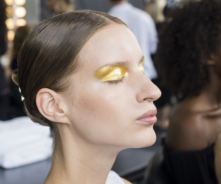 New York, NY, USA - September 11, 2016: A model prepares backstage for the Custo Barcelona women's & men's Spring/Summer 2017 runway show during New York Fashion Week SS 2017 at Pier 59 Studios at Chelsea Piers, Manhattanのeditorial素材