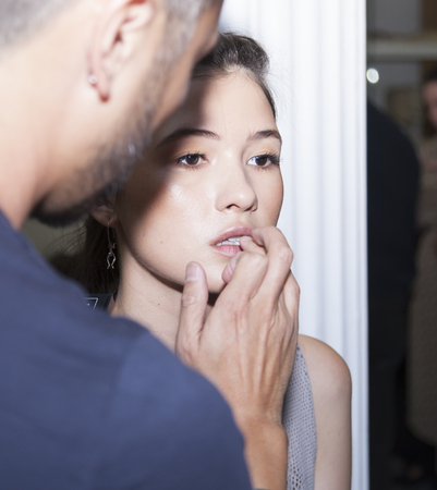 New York, NY, USA - September 7, 2016: A model prepares backstage for the WHIT Spring?Summer 2017 collection presentation during New York Fashion Week SS 2017 at The New York Academy of Artのeditorial素材