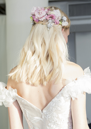 New York, NY, USA - October 5, 2016: A model shows out a dress by Georgina Chapman and Keren Craig for Marchesa Fall/Winter 2017 Bridal Presentation during New York International Bridal Week at Canoe Studio, Manhattanのeditorial素材