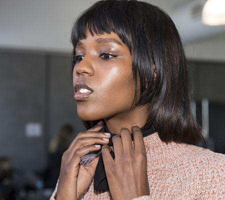 New York, NY, USA - February 10, 2017: A model prepares backstage for Oday Shakar FW17 collection runway show during New York Fashion Week at Pier 59 Studios, Manhattanのeditorial素材