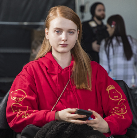 New York, NY, USA - February 10, 2017: A model prepares backstage for Oday Shakar FW17 collection runway show during New York Fashion Week at Pier 59 Studios, Manhattanのeditorial素材