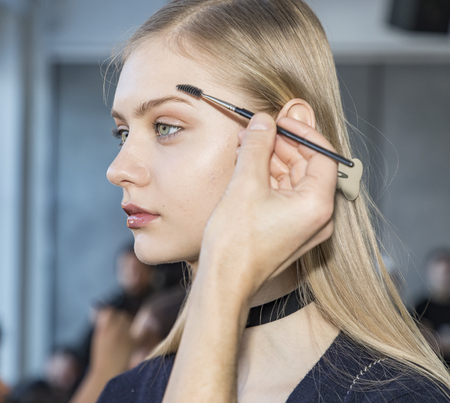 New York, NY, USA - February 10, 2017: A model prepares backstage for Oday Shakar FW17 collection runway show during New York Fashion Week at Pier 59 Studios, Manhattanのeditorial素材