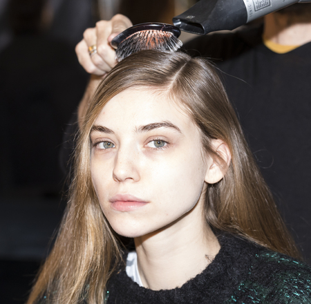New York, NY, USA - February 12, 2017: A model prepares backstage for the Custo Barcelona Fall/Winter 2017 runway show during New York Fashion Week at Pier 59 Studios at Chelsea Piers, Manhattanのeditorial素材