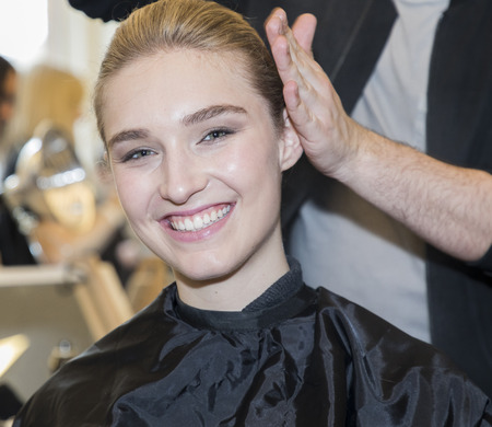 New York, NY, USA - April 21, 2017: A model prepares backstage for Monique Lhuillier Runway Bridal Show Spring/Summer 2018 during New York International Bridal Week at Weill Music Room at Carnegie Hall, Manhattanのeditorial素材