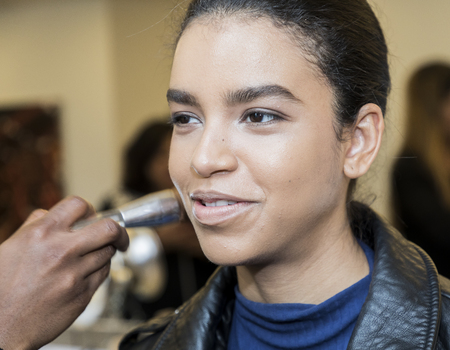 New York, NY, USA - April 21, 2017: A model prepares backstage for Monique Lhuillier Runway Bridal Show Spring/Summer 2018 during New York International Bridal Week at Weill Music Room at Carnegie Hall, Manhattanのeditorial素材