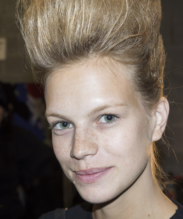 New York, NY, USA - September 13, 2017: A model prepares backstage for the Marchesa Spring/Summer 2018 runway show during New York Fashion Week at Skylight Clarkson Sq., Manhattanのeditorial素材
