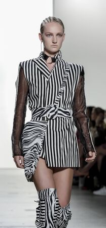 New York, NY, USA - September 11, 2017: A model walks runway for the Hakan Akkaya Spring/Summer 2018 runway show during New York Fashion Week at Skylight Clarkson Sq., Manhattanのeditorial素材