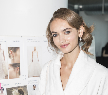 New York, NY, USA - October 5, 2017: A model prepares backstage for Marchesa and Notte Fall/Winter 2018 Bridal Presentation by Georgina Chapman and Keren Craig during New York Bridal Week at Canoe Studio, Manhattanのeditorial素材