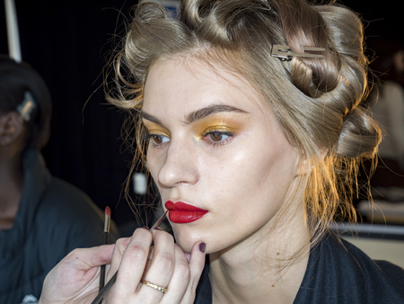 New York, NY, USA - February 8, 2018: A model prepares backstage for Tadashi Shoji Fall/Winter 2018 runway show during New York Fashion Week Spring Studios., Manhattanのeditorial素材