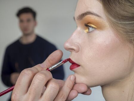 New York, NY, USA - February 8, 2018: A model prepares backstage for Tadashi Shoji Fall/Winter 2018 runway show during New York Fashion Week Spring Studios., Manhattanのeditorial素材