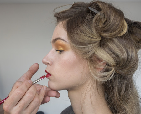 New York, NY, USA - February 8, 2018: A model prepares backstage for Tadashi Shoji Fall/Winter 2018 runway show during New York Fashion Week Spring Studios., Manhattanのeditorial素材