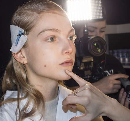 New York, NY, USA - February 8, 2018: A model prepares backstage for Noon by Noor Fall/Winter 2018 runway show during New York Fashion Week at Spring Studios, Manhattanのeditorial素材