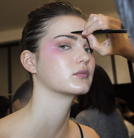 New York, NY, USA - February 10, 2018: A model prepares backstage for Son Jung Wan Fall/Winter 2018 runway show during NY Fashion Week at Spring Studios, Manhattanのeditorial素材