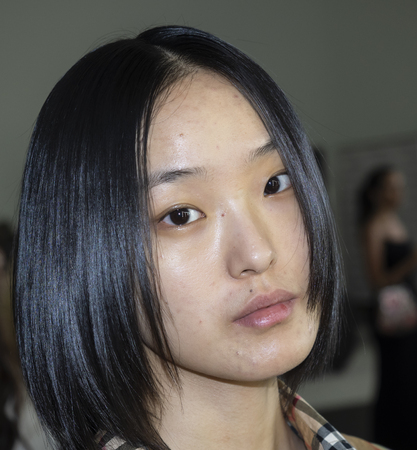 New York, NY, USA - September 6, 2018: A model prepares backstage for the Pamella Roland Spring/Summer 2019 runway show during New York Fashion Week at Pier 59 Studuos, Manhattanのeditorial素材