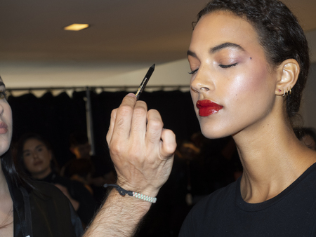 New York, NY, USA - September 11, 2018: A model prepares backstage for the Naeem Khan Spring/Summer 2019 runway show during New York Fashion Week at Spring Studios, Manhattanのeditorial素材