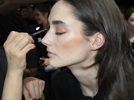 New York, NY, USA - February 8, 2019: A model prepares backstage for the  Cushnie Fall/Winter 2019 collection during New York Fashion at Spring Studios, Manhattanのeditorial素材