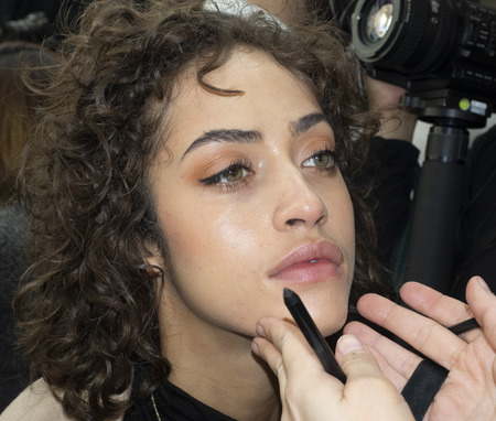 New York, NY, USA - February 8, 2019: A model prepares backstage for the  Cushnie Fall/Winter 2019 collection during New York Fashion at Spring Studios, Manhattanのeditorial素材