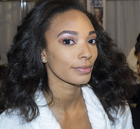 New York, NY, USA - April 11, 2019: A model prepares backstage for the Theia Bridal Spring 2020 collection during New York Bridal Week at the Theia Showroom, Manhattanのeditorial素材