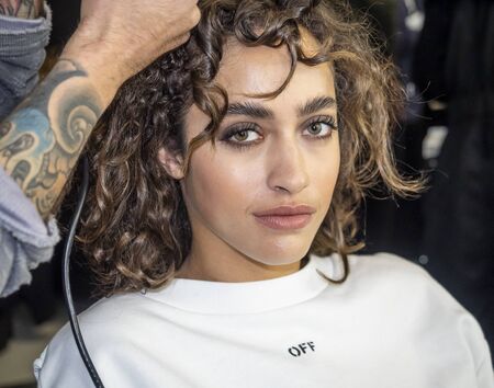 New York, NY, USA - February 7, 2020: A model prepares backstage for Pamella Roland Fall/Winter 2020 collection during New York Fashion Week at Pier 59 Studuos, Manhattanのeditorial素材