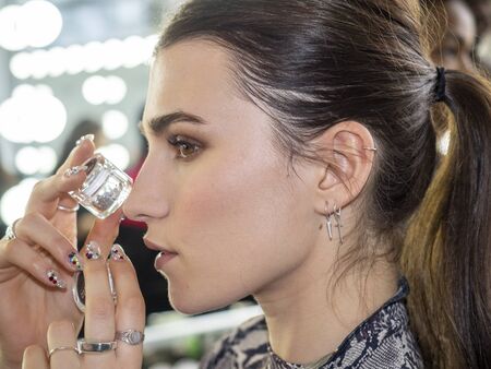 New York, NY, USA - February 7, 2020: A model prepares backstage for Pamella Roland Fall/Winter 2020 collection during New York Fashion Week at Pier 59 Studuos, Manhattanのeditorial素材