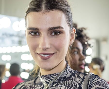 New York, NY, USA - February 7, 2020: A model prepares backstage for Pamella Roland Fall/Winter 2020 collection during New York Fashion Week at Pier 59 Studuos, Manhattanのeditorial素材