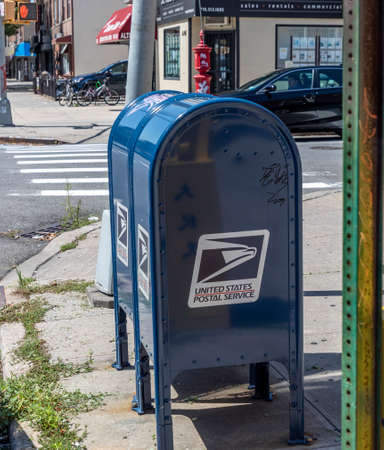 Brooklyn, NY, USA - August 18, 2020: View of United Siates Postal Sercice Mailbox amid postal...