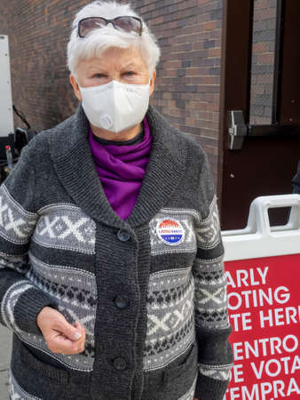 Brooklyn, NY, USA - October 27, 2020: Voters exit poll site after they cast their votes for early general voting at St. Dominic's Catholic Church, Brooklyn amid coronavirus pandemic.のeditorial素材